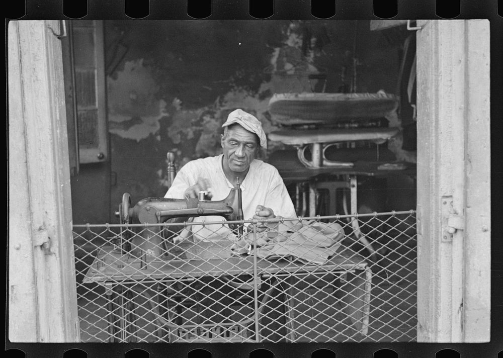 Scene in New Orleans, Louisiana. A street tailor. Sourced from the Library of Congress.