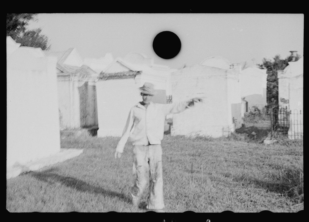 [Untitled photo, possibly related to: Tomb painter in cemetery at Pointe a la Hache, Louisiana]. Sourced from the Library of…