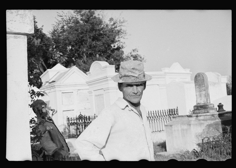 Tomb painter in cemetery at Pointe a la Hache, Louisiana. Sourced from the Library of Congress.