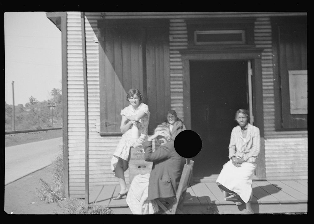 [Untitled photo, possibly related to: The Shack, a one time church; milk is dispensed here. Relief clients wait for hours…