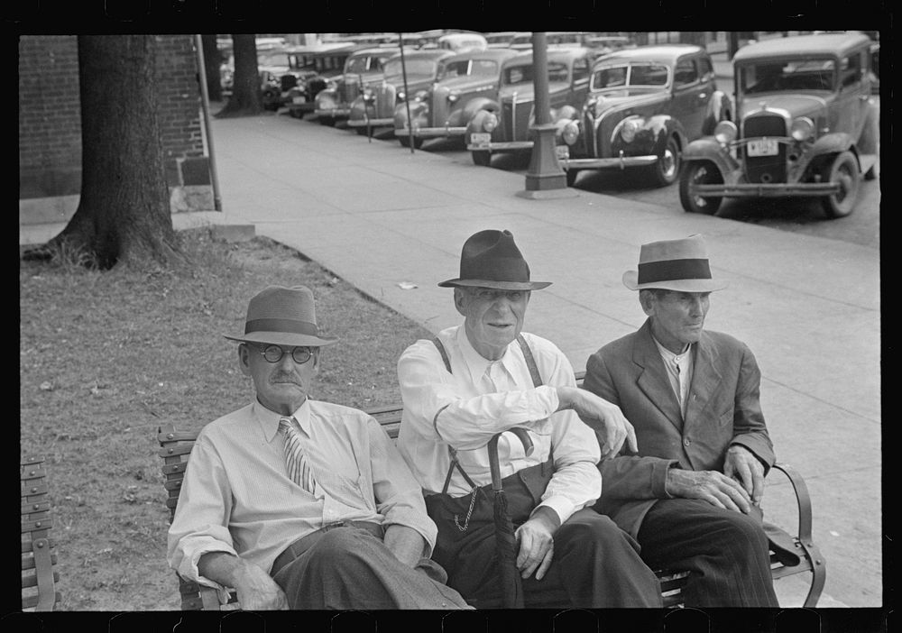 Men sitting on bench in square, Springfield, Ohio. Sourced from the Library of Congress.