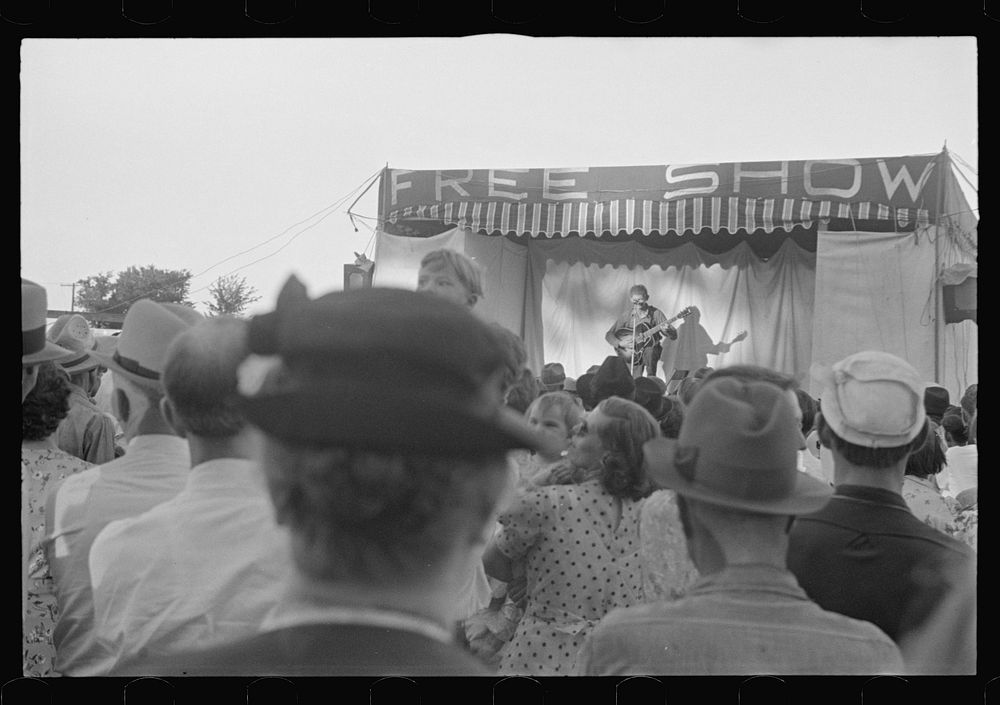 [Untitled photo, possibly related to: Ashville, Ohio. Sideshows at the Fourth of July celebration]. Sourced from the Library…