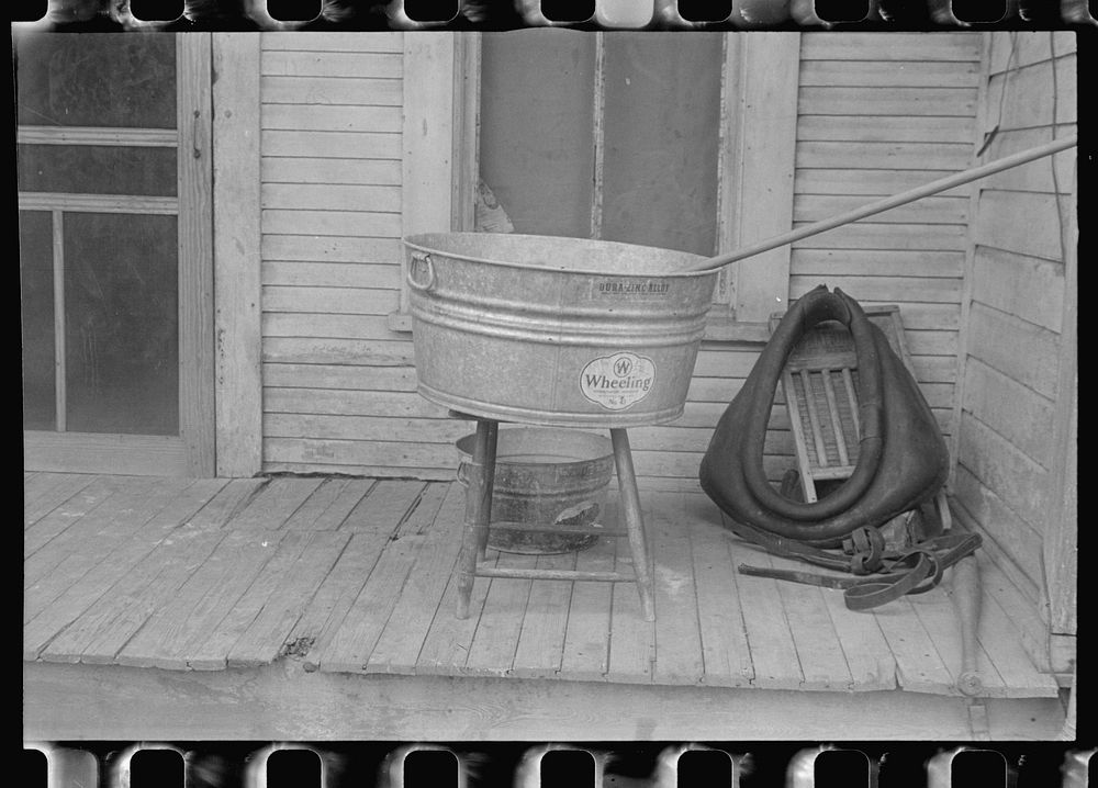 On the back porch of the Thaxton farmhouse, Mechanicsburg, Ohio. Sourced from the Library of Congress.