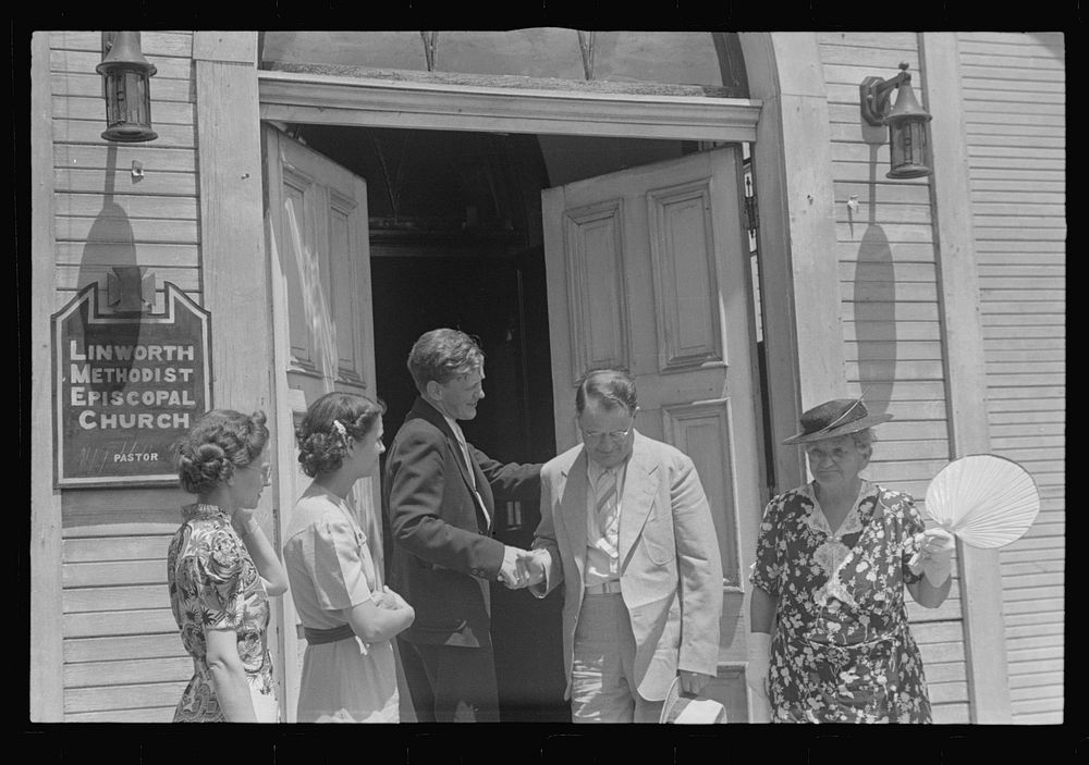 Pastor greeting his parishioners, Linworth, Ohio. Sourced from the Library of Congress.