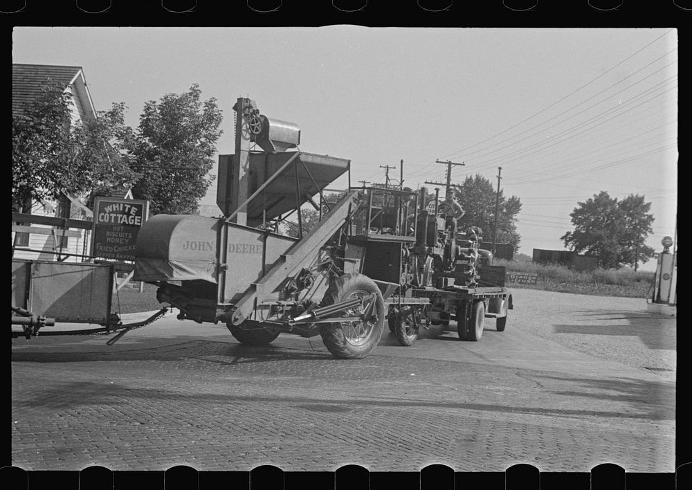 [Untitled photo, possibly related to: Moving combine and tractor, central Ohio (see general caption)]. Sourced from the…
