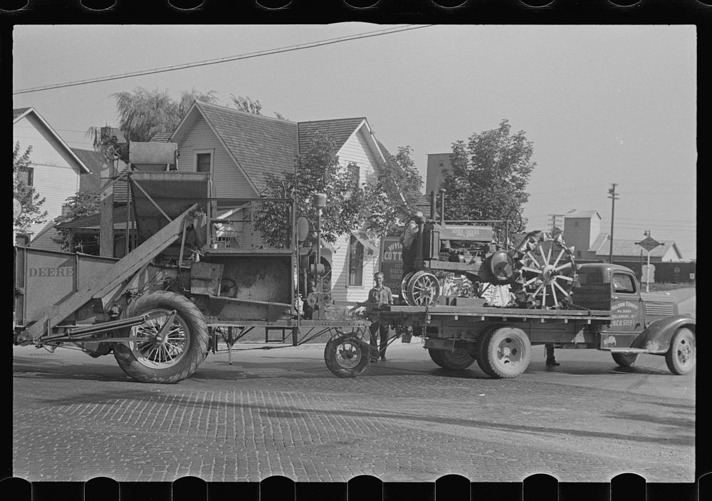 [Untitled photo, possibly related to: Moving combine and tractor, central Ohio (see general caption)]. Sourced from the…