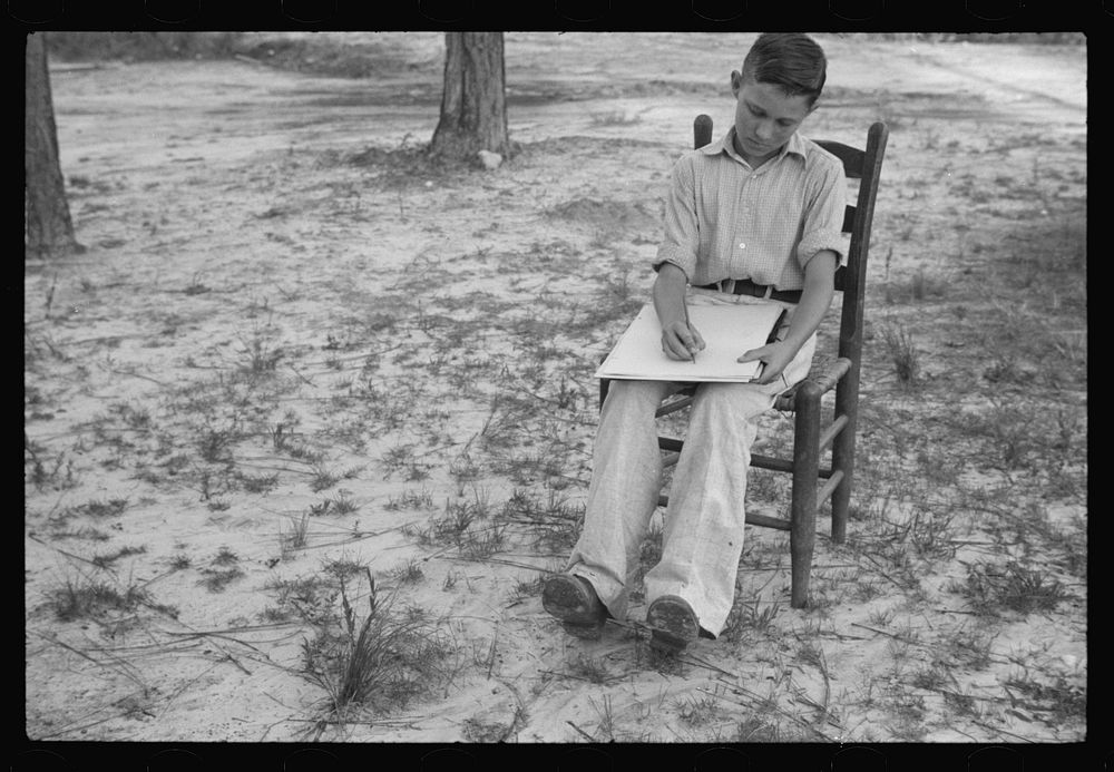 [Untitled photo, possibly related to: Boy drawing, Penderlea Homesteads, North Carolina]. Sourced from the Library of…