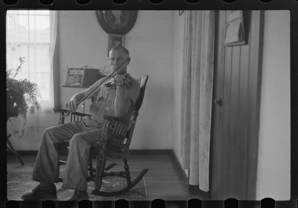 [Untitled photo, possibly related to: One of the Westmoreland homesteaders playing his violin, Pennsylvania]. Sourced from…