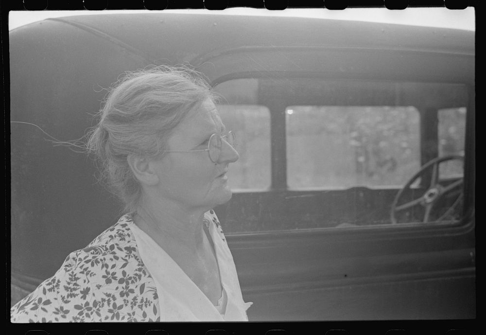 Farmer's wife watching proceedings at farm auction, New Carlisle [i.e. Marysville], Ohio. Sourced from the Library of…