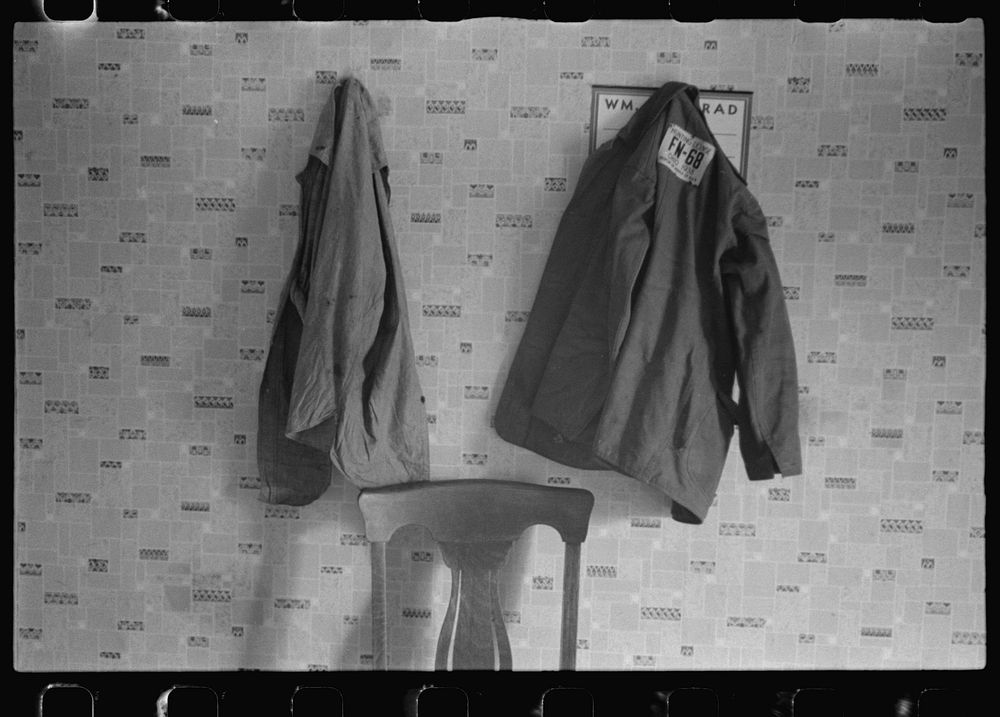 Clothes hanging in house at farmland auction, New Carlisle [i.e. Marysville], Ohio. Sourced from the Library of Congress.
