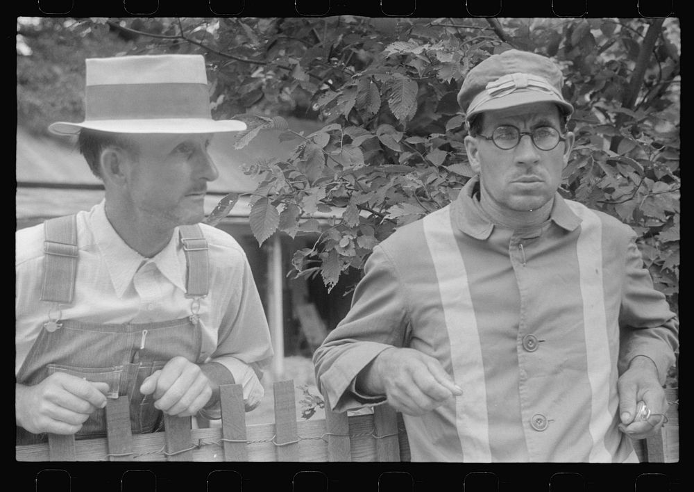 Spectator and clocker at county fair in central Ohio. Sourced from the Library of Congress.