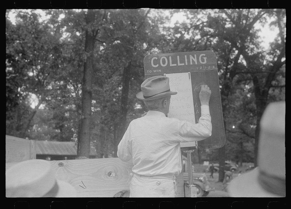 Chalking up race results at county fair in central Ohio. Sourced from the Library of Congress.