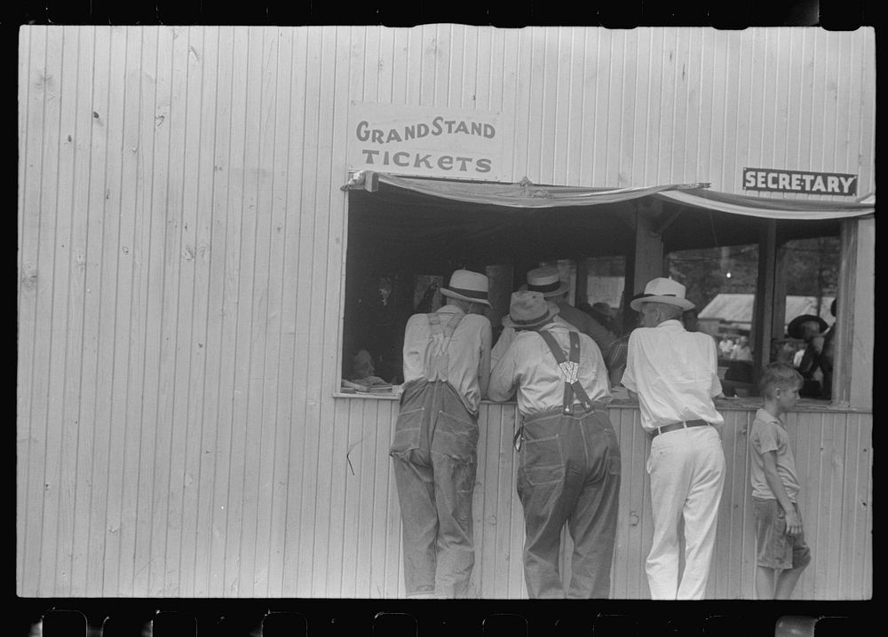 Purchasing tickets at county fair, central Ohio. Sourced from the Library of Congress.