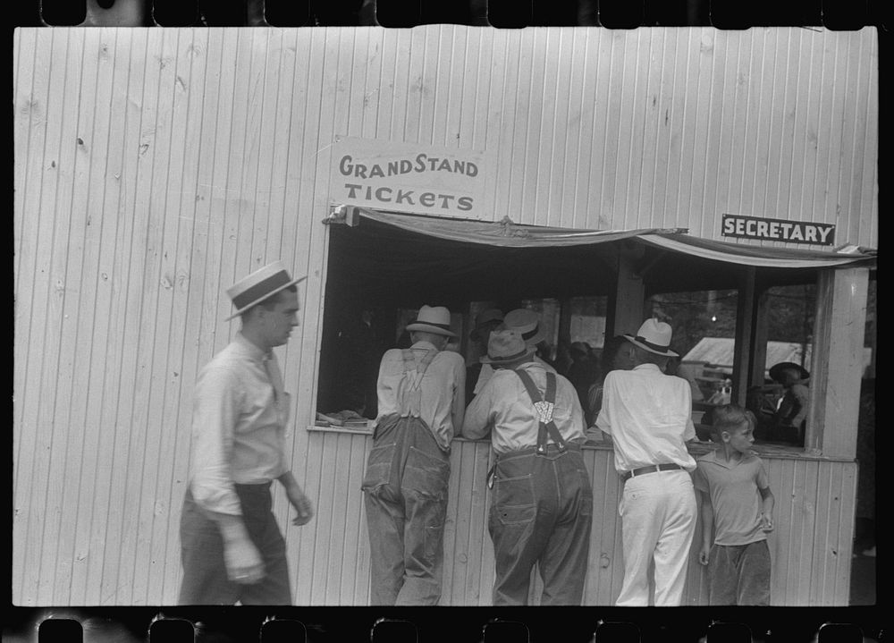 [Untitled photo, possibly related to: Purchasing tickets at county fair, central Ohio]. Sourced from the Library of Congress.