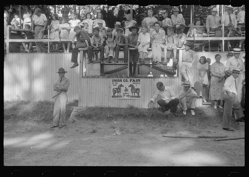 State police and spectators at county fair in central Ohio. Sourced from the Library of Congress.