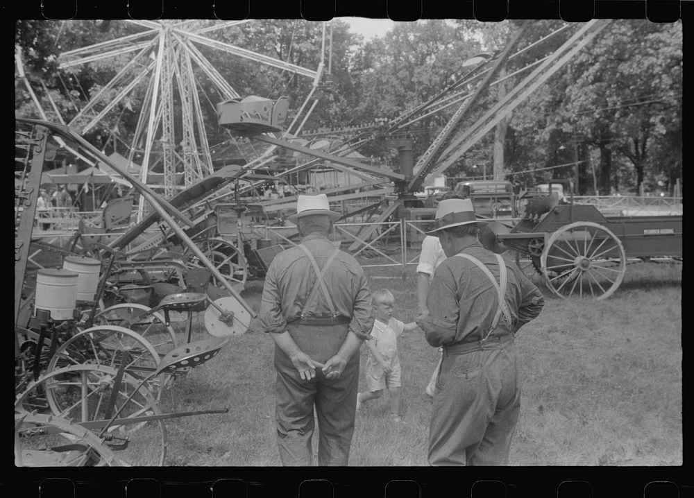 [Untitled photo, possibly related to: Farm machinery display at county fair, central Ohio]. Sourced from the Library of…