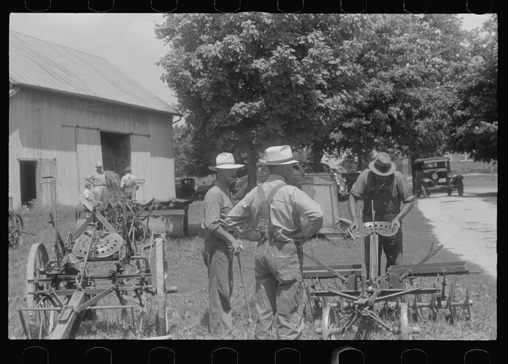 Inspecting farm machinery at public auction, central Ohio. Sourced from the Library of Congress.