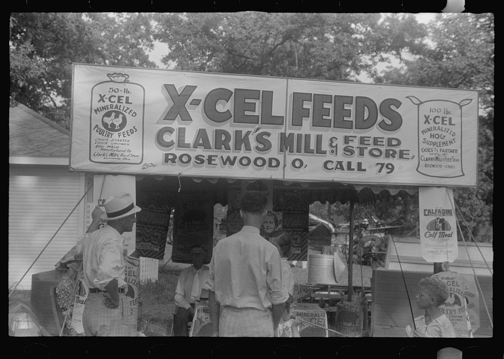 Advertising feeds at county fair, central Ohio. Sourced from the Library of Congress.