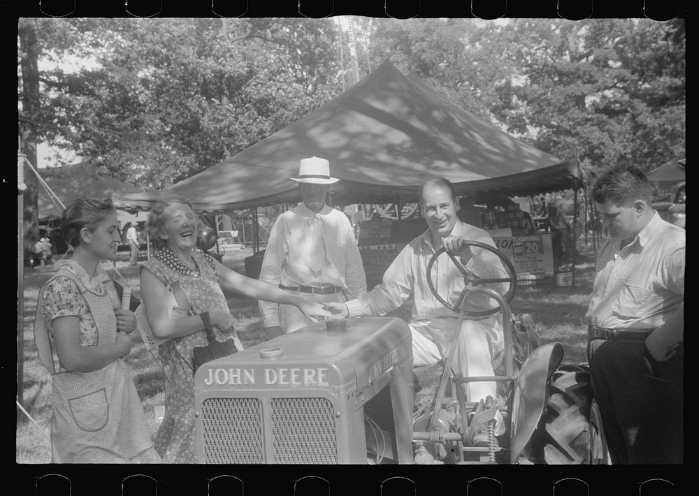[Untitled photo, possibly related to: Farmers talking at county fair, central Ohio]. Sourced from the Library of Congress.