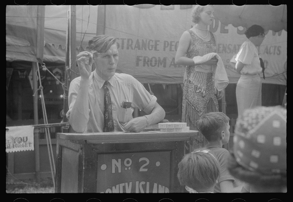 Selling tickets to the sideshow, county fair, central Ohio. Sourced from the Library of Congress.