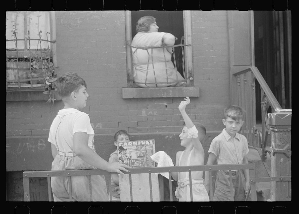 New York, New York. 61st Street between 1st and 3rd Avenues. Children playing in the street. Sourced from the Library of…