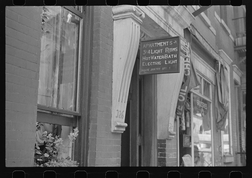 New York, New York. 61st Street between 1st and 3rd Avenues. A sign offering apartments for rent. Sourced from the Library…