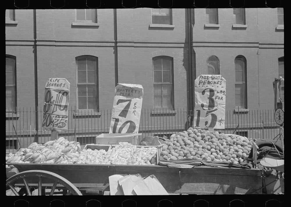 New York. New York, 61st Street between 1st and 3rd Avenues. A fruit and vegetable vendor stand. Sourced from the Library of…