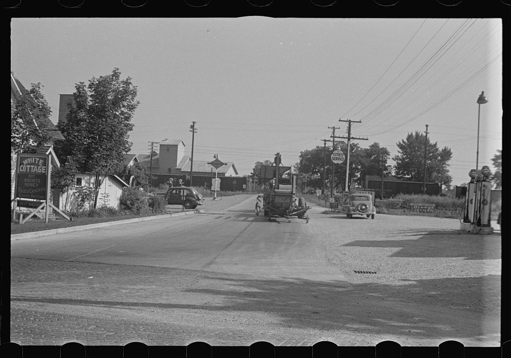 [Untitled photo, possibly related to: Cars parked beside feed store, Plain City, Ohio]. Sourced from the Library of Congress.