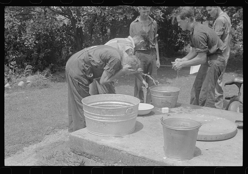 [Untitled photo, possibly related to: Washing up before dinner during wheat harvest, Central Ohio]. Sourced from the Library…