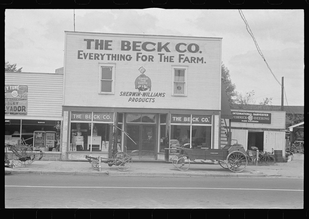 [Untitled photo, possibly related to: Farm implements outside store, Canal Winchester, Ohio]. Sourced from the Library of…