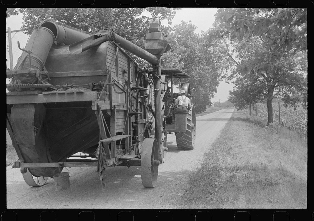 [Untitled photo, possibly related to: Steam thresher. These machines move from job to job under their own power, central…
