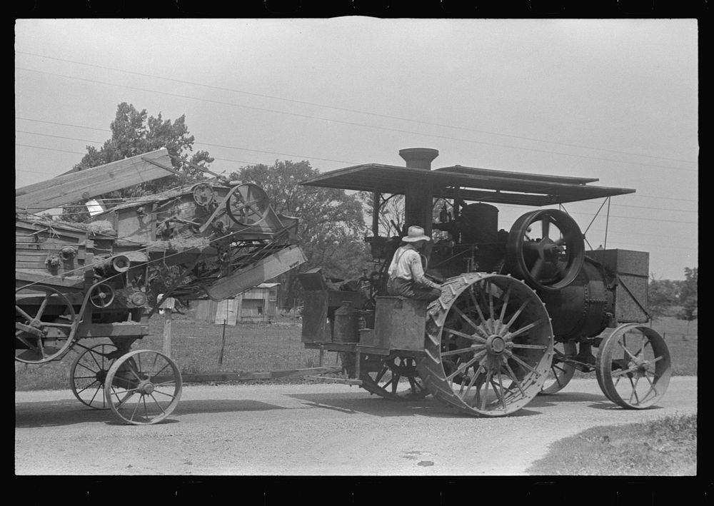Steam tractor pulling grain separator along country road, central Ohio. Sourced from the Library of Congress.