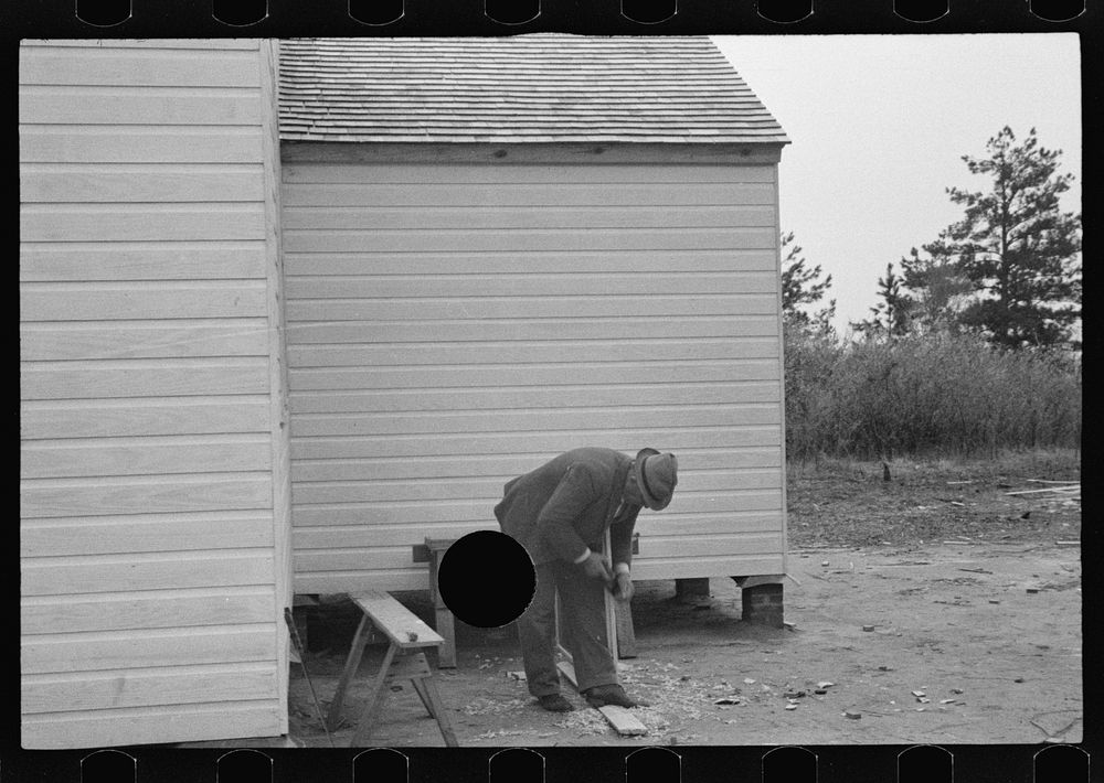 [Untitled photo, possibly related to: Carpenter at work, Eatonton, Georgia. Briar Patch Project]. Sourced from the Library…
