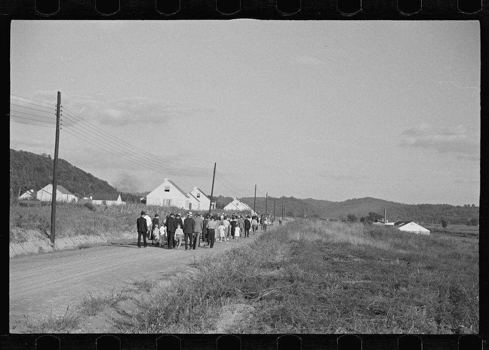 [Untitled photo, possibly related to: Funeral procession of first death on project. Boy five years old. Red House Farms…