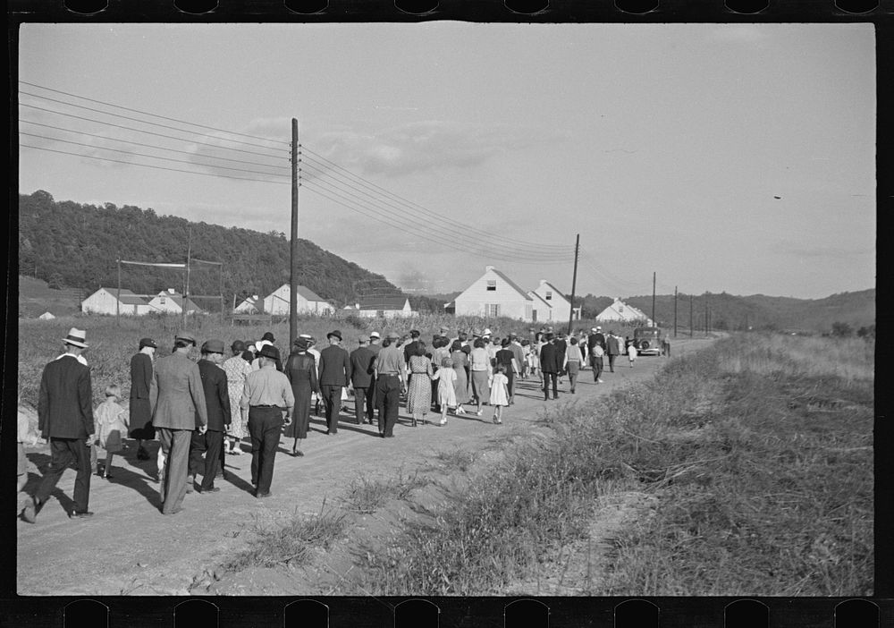 [Untitled photo, possibly related to: Funeral procession of first death on project. Boy five years old. Red House Farms…