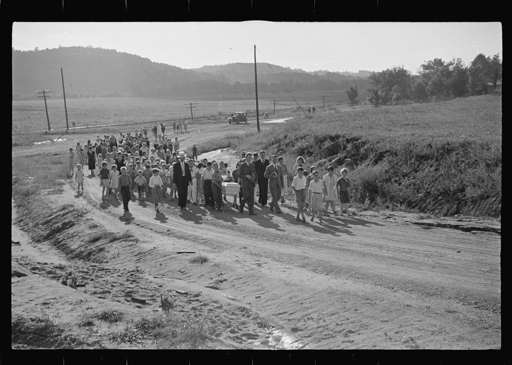 Funeral procession of first death on project. Boy five years old. Red House Farms, West Virginia. Sourced from the Library…