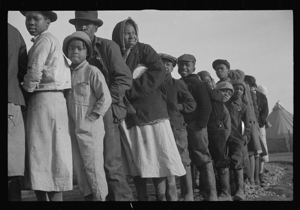 [Untitled photo, possibly related to: es in the lineup for food at the flood refugee camp, Forrest City, Arkansas]. Sourced…