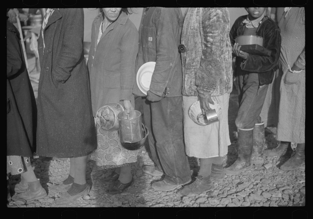 [Untitled photo, possibly related to: es at mealtime in the flood refugee camp, Forrest City, Arkansas]. Sourced from the…
