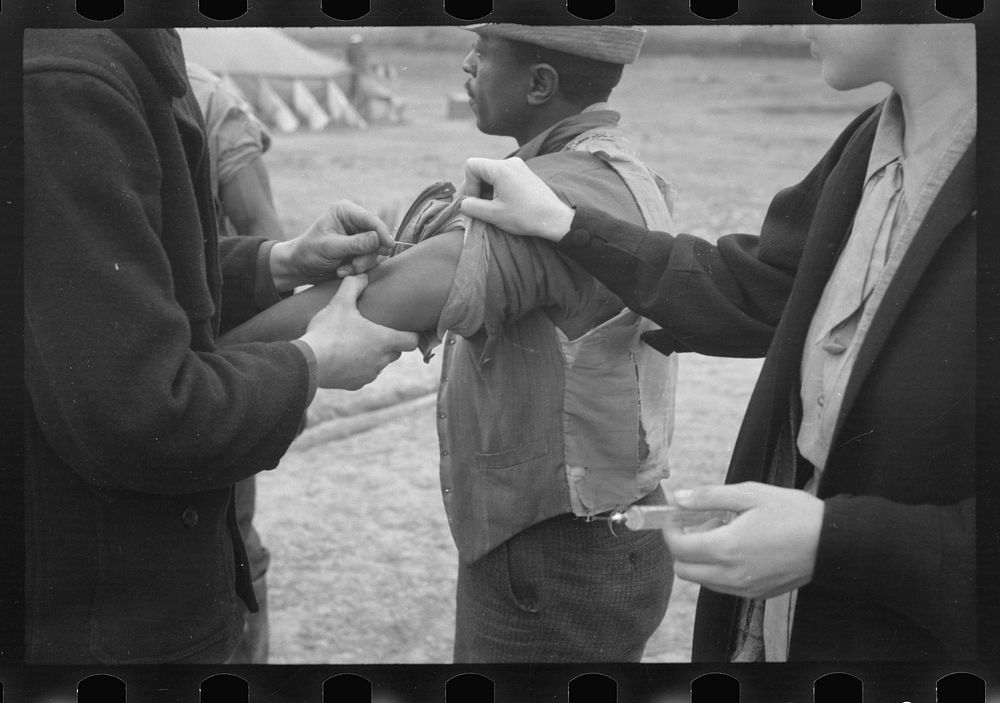 [Untitled photo, possibly related to: Vaccination in the camp for  flood refugees at Marianna, Arkansas]. Sourced from the…