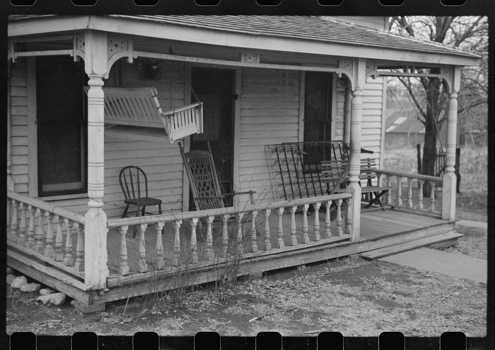 [Untitled photo, possibly related to: Mayetta, Kansas. Porch swing up for the winter]. Sourced from the Library of Congress.