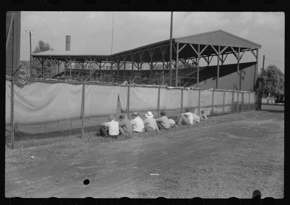 [Untitled photo, possibly related to: Watching ballgame. Vincennes, Indiana]. Sourced from the Library of Congress.