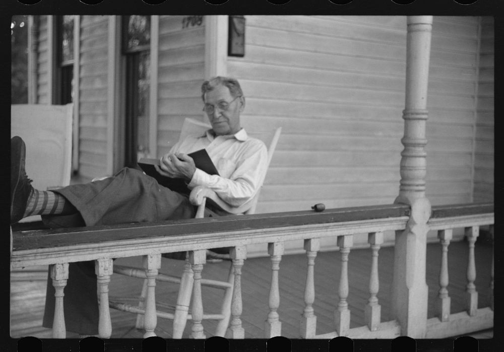 [Untitled photo, possibly related to: Front porch. Sunday afternoon, Vincennes, Indiana]. Sourced from the Library of…
