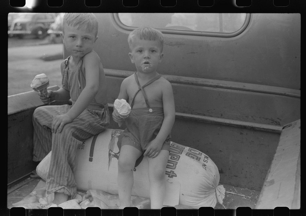 [Untitled photo, possibly related to: Farm boys eating ice-cream cones. Washington, Indiana]. Sourced from the Library of…