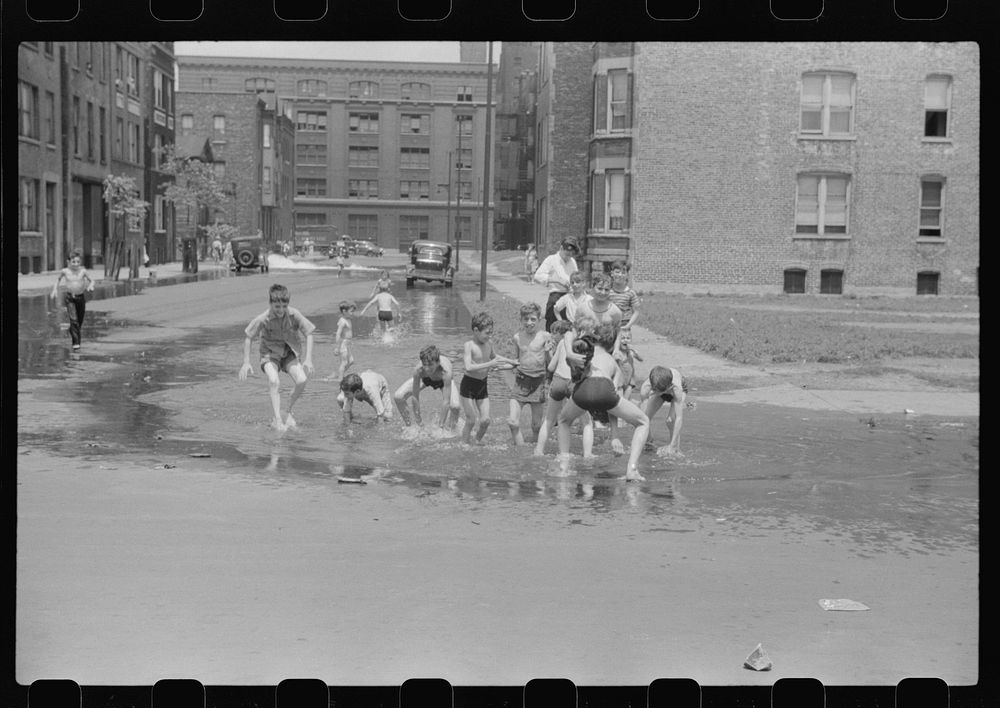 Cooling off in water from hydrant, Chicago, Illinois. Sourced from the Library of Congress.