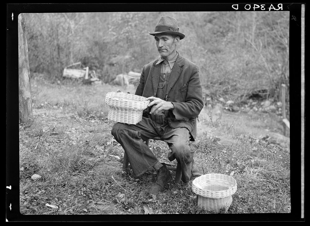 John Nicholson with some of the baskets he weaves. Shenandoah National Park, Virginia. Sourced from the Library of Congress.