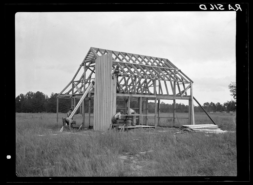 Barn being constructed at Penderlea Farms, North Carolina. Sourced from the Library of Congress.
