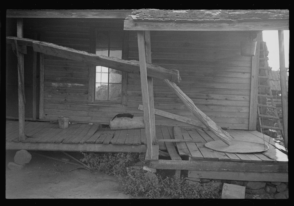 Porch of a sharecropper's cabin, Hale County, Alabama. Sourced from the Library of Congress.