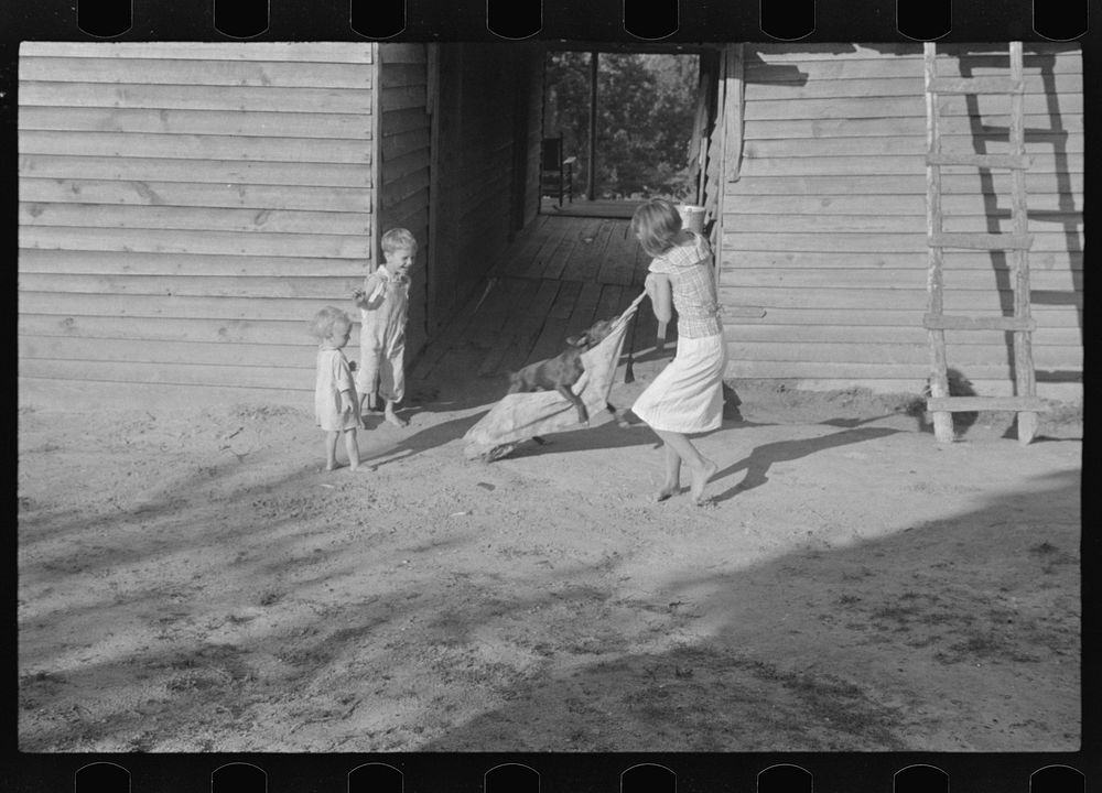 [Untitled photo, possibly related to: Burroughs children playing in the yard, Hale County, Alabama]. Sourced from the…