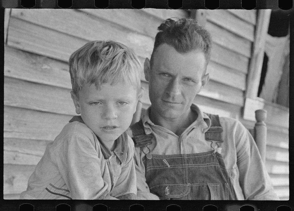 Charles and his father Floyd Burroughs, Alabama cotton sharecropper. Sourced from the Library of Congress.