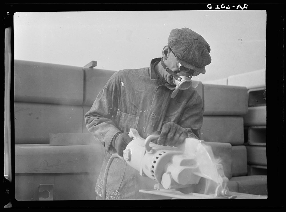 Tile cutter, Hightstown, New Jersey, showing modern health methods used in this work. Sourced from the Library of Congress.